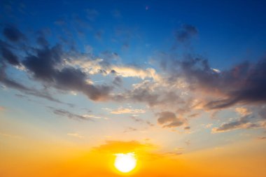 red dramatic sunset ob lue cloudy sky, neatural evening sky background