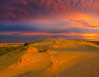 sandy desert dune at the dramatic sunset