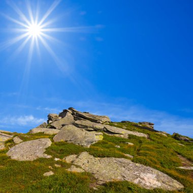 green mountain valley under a sparkle sun, summer mountain travel background