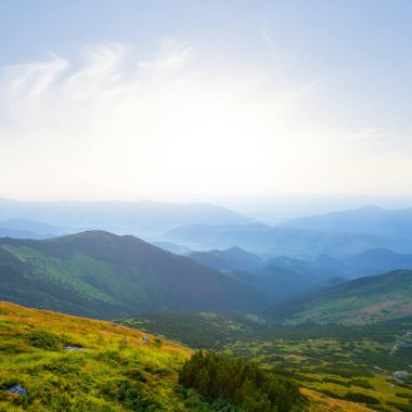mountain valley in blue mist at the early morning, summer moutain travel background