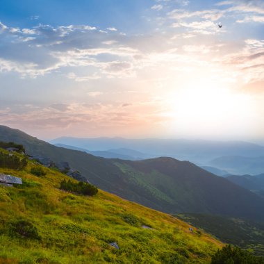 mountain valley in blue mist at the early morning, summer moutain travel background