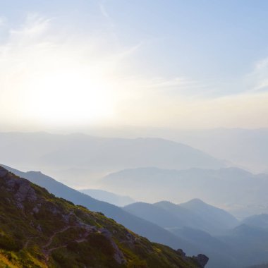 mountain valley in blue mist at the early morning, summer moutain travel background