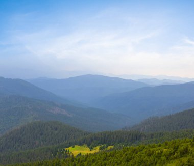 mountain valley in blue mist at the early morning, summer moutain travel background