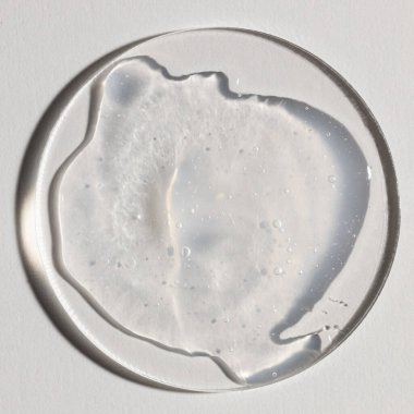 Şeffaf serum, kozmetik dokular, cilt ürünü lekesi yüz serumu, yağ, temizleyici.