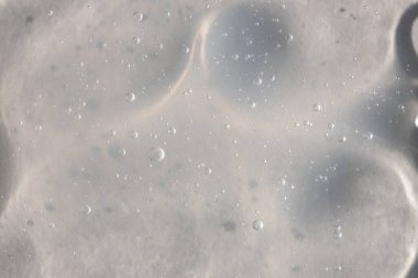 Şeffaf serum, kozmetik dokular, cilt ürünü lekesi yüz serumu, yağ, temizleyici.