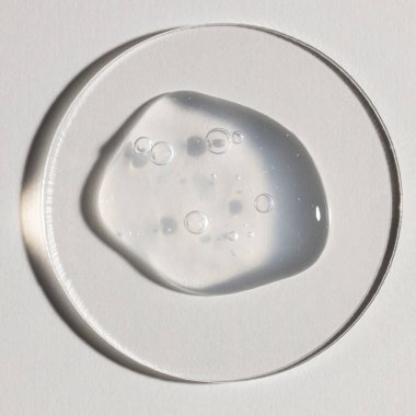 Şeffaf serum, kozmetik dokular, cilt ürünü lekesi yüz serumu, yağ, temizleyici.