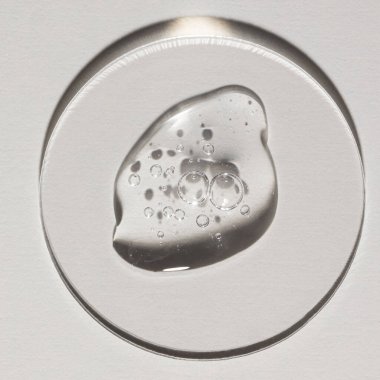 Şeffaf serum, kozmetik dokular, cilt ürünü lekesi yüz serumu, yağ, temizleyici.