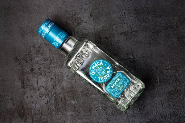 Bottle of tequila on black background. 