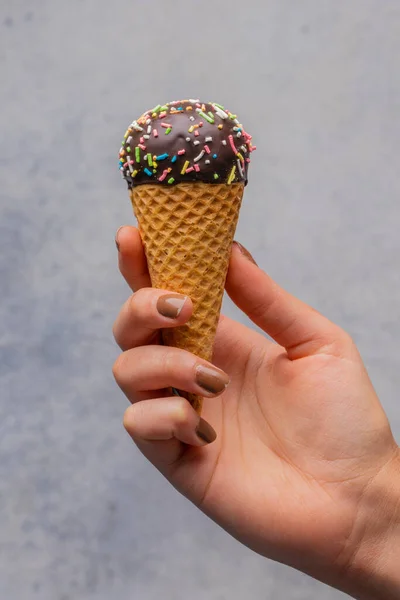 Ice cream cone with colorful sprinkles