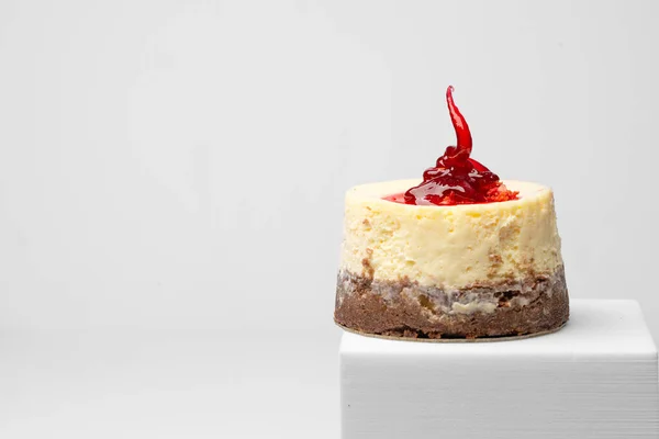 stock image Cheese cake with raspberry on white background