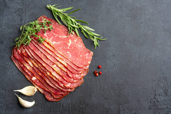 Dried Turkish Pastrami Slices On Black  Background