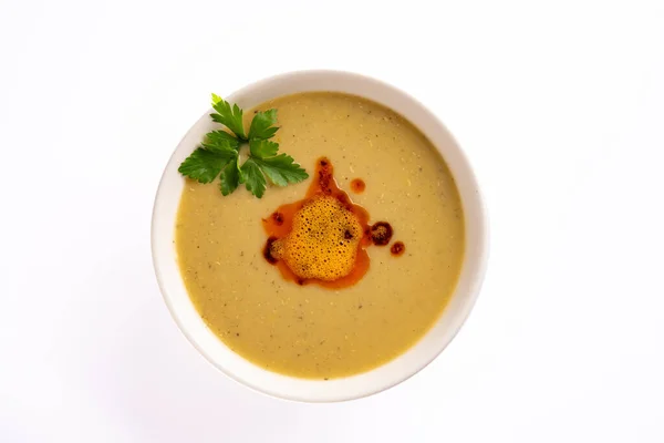 Delicious lentil soup on white background