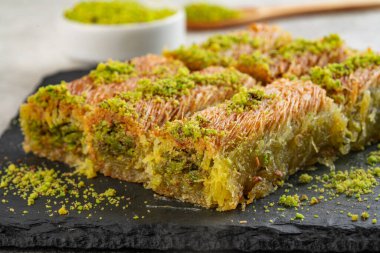 Delicious Turkish dessert pistachio kadayif. Burma kadayf clipart