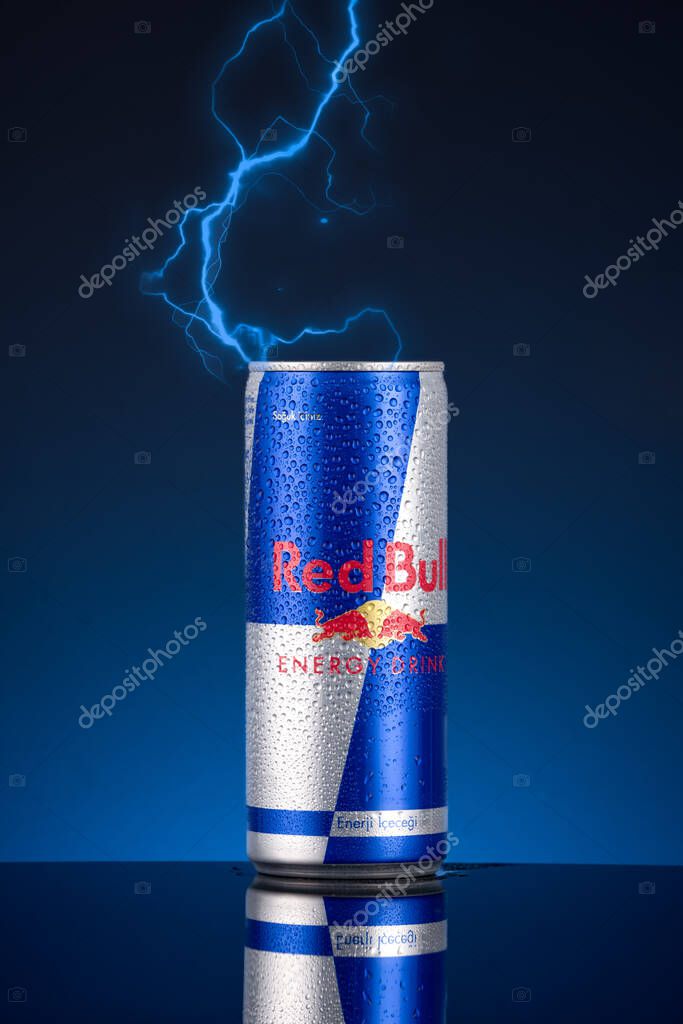 Red Bull energy drink can on black background