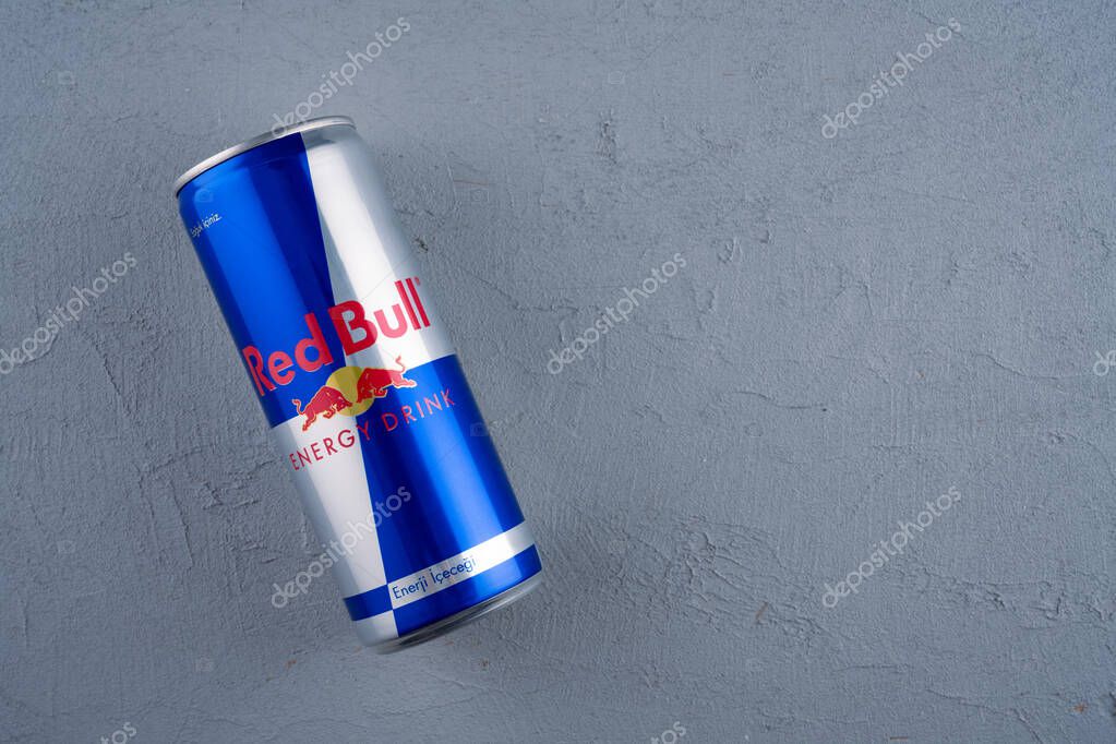 Red Bull energy drink can on black background