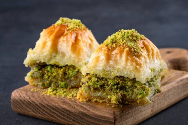 Traditional Turkish dessert baklava with pistachios clipart