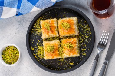 Traditional Turkish dessert baklava with pistachios clipart