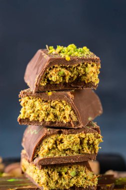 Chocolate bar filled with pistachio kunafa. Dubai chocolate clipart