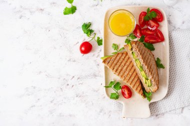 Vegan sandwich with cheese and avocado. Vegetarian breakfast. Top view, flat lay