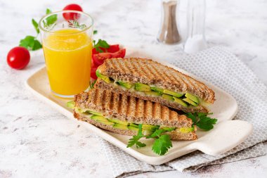 Vegan sandwich with cheese and avocado. Vegetarian breakfast.