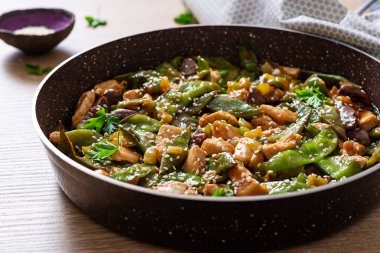 Stir fry chicken, green peas and green beans.. Asian style