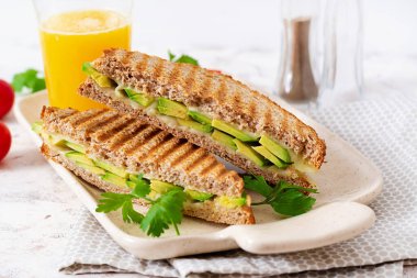 Vegan sandwich with cheese and avocado. Vegetarian breakfast.