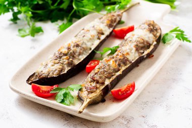 Stuffed eggplant with beef meat, vegetable and cheese.