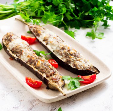 Stuffed eggplant with beef meat, vegetable and cheese.