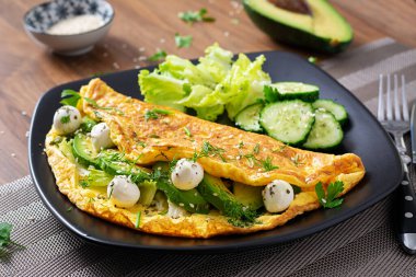 Omelette with mozzarella cheese and avocado. Ketogenic, keto diet breakfast.
