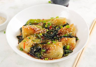 Homemade asian sauteed soy bok choy with sesame seeds. Stir fry pak choi. Asian food clipart