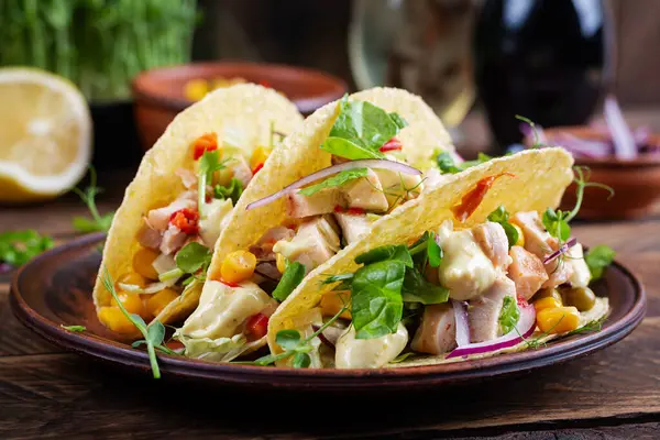 Mexican tacos with chicken meat, corn and salsa. Healthy tacos. Diet menu. Mexican taco.
