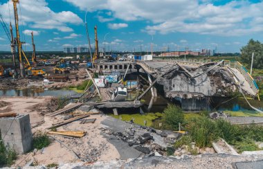 IRPIN, KYIV REGION, UKRAINE - AUGUST 2022. Reconstruction of the destroyed bridge clipart