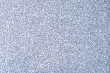 Parlak arka plan, yansımalarla dolu parıltılı doku ve gümüş rengi süslemeler.