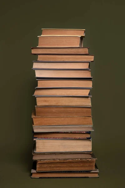 Tall Tower Old Books Have Yellowed Pages Olive Green Background — Stock Photo, Image