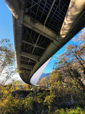 Bellinzona Monte Carasso modern footbridge over the river Ticino in the Ticino Canton, Switzerland clipart