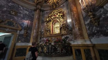 BOLOGNA, ITALY - SEPTEMBER 9, 2025: the Madonna of San Luca Basilica , people under the visual representation of the Virgin Mary and her infant son, Jesus