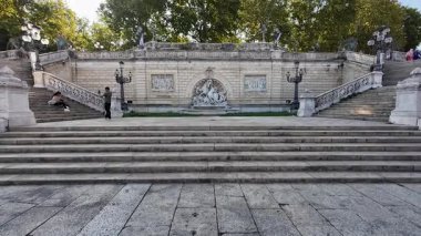 BOLOGNA, ITALY - SEPTEMBER 12, 2025:  people on the staircase of the Montagnola Public park