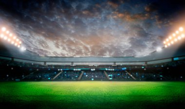 Yeşil futbol sahası, parlak ışıklar, aydınlık stadyum.