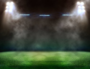 Yeşil futbol sahası, parlak spot ışıkları,