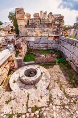 The archaeological site of Eleusis. Well of the fair dances where goddess Demeter rested, when she first came to Eleusis. Eleusinian women performed dances in honor of her. Attica, Greece. clipart