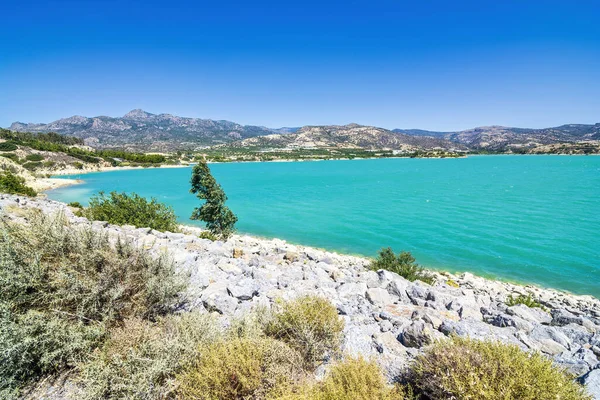 Bramian Lake in Ierapetra, Crete, Greece. The artificial Bramian Lake was built in 1986 to cover the cultivation needs of 30,000 acres of Ierapetra. The lake has an area of 1050 acres and a capacity of 15 million cubic meters, making it the third-lar