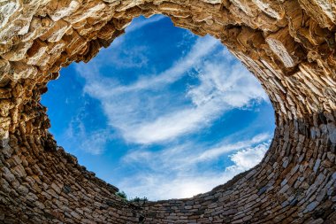 Mycenaean tholos tomb at Thorikos, Attica, Greece. The Mycenaean graves at Thorikos illustrate perfectly the evolution of tomb types.