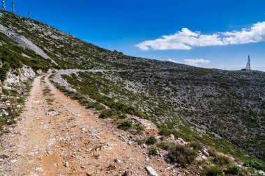 Penteli mountain country road at Attica, Greece. Situated north of Athens city center, mount Penteli is famous for its white marble, which was used to build the Acropolis. clipart