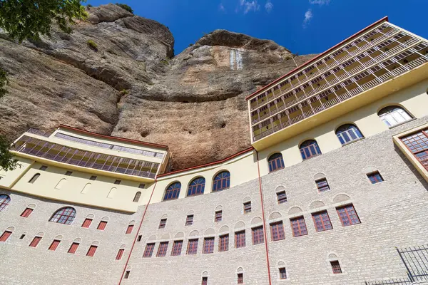 stock image View of the Monastery Of Mega Spilaio in Kalavryta, Greece. The monastery is located in a large cave on a sheer cliff. Formerly known as the Monastery of the Dormition of the Theotokos.