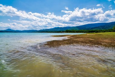 Idyllic landscape on the lake of Plastiras in central Greece. Lake Plastiras is an artificial lake fed by Tavropos river, located in Karditsa regional unit, near the city of Karditsa, Greece. clipart