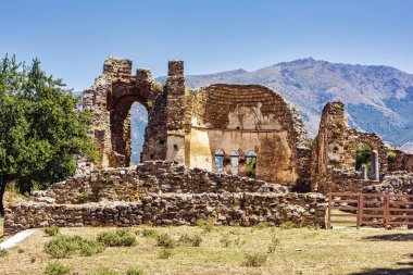 The Basilica of Agios Achilleios, a ruined 10th-11th century Christian church, located on Agios Achilleios Island in Lake Mikri Prespa, Greece. clipart