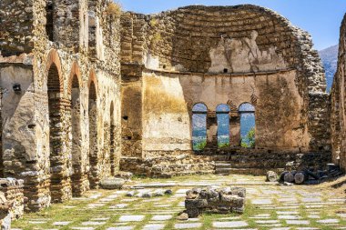 The Basilica of Agios Achilleios, a ruined 10th-11th century Christian church, located on Agios Achilleios Island in Lake Mikri Prespa, Greece. clipart