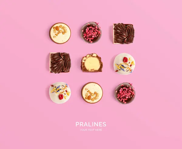 Creative Layout Made Pralines Pink Background Flat Lay Food Concept — Stock Photo, Image