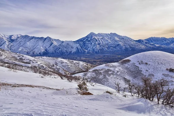 Timpanogos Peak snow covered mountain views from Maack Hill hiking Lone Peak Wilderness Wasatch Rocky Mountains, Utah. United States.