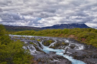 Bruarfoss or Bridge Falls, small hidden waterfall blue striking color, Icelands Bluest Waterfall, along Bruara river. Golden Circle South Iceland clipart